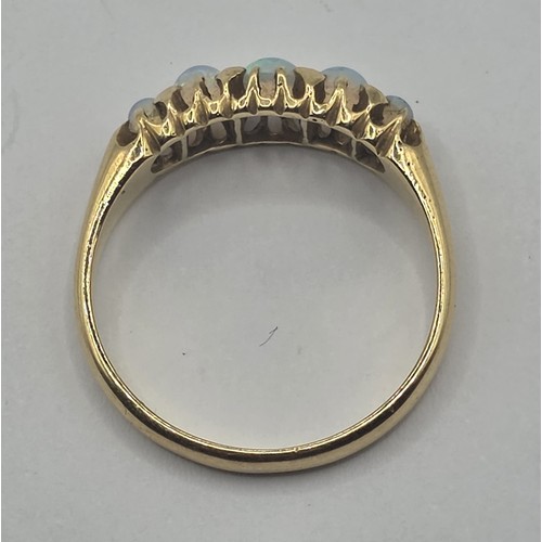 485 - An 18ct gold and five stone opal ring, ring size T