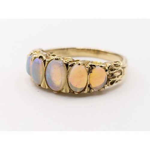 427 - A 9ct gold and five stone opal ring, ring size R