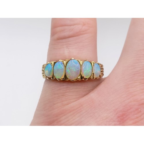 427 - A 9ct gold and five stone opal ring, ring size R
