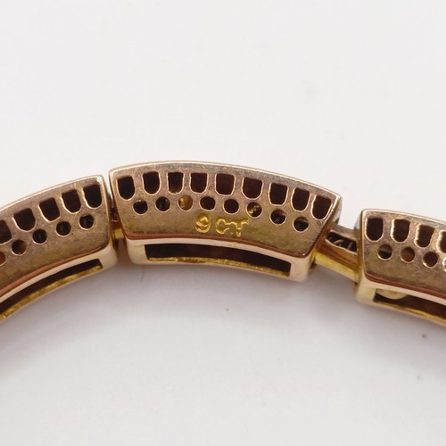 429 - A yellow coloured metal bracelet, testing as 9ct and a 9ct gold St Christopher, 14.1 g
