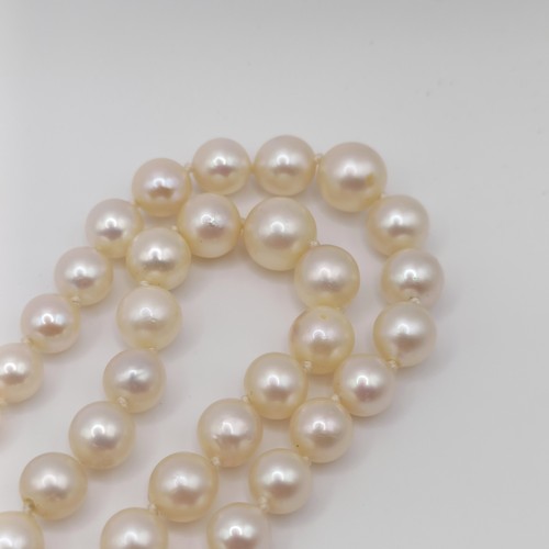 435 - A cultured pearl double necklace, with a 9ct gold and citrine clasp