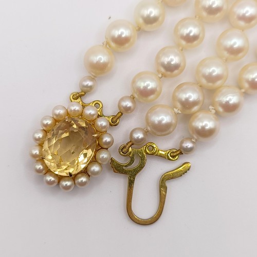 456 - A cultured pearl double necklace, with a 9ct gold and citrine clasp