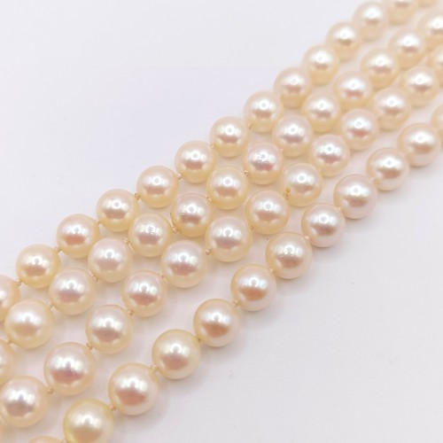 456 - A cultured pearl double necklace, with a 9ct gold and citrine clasp