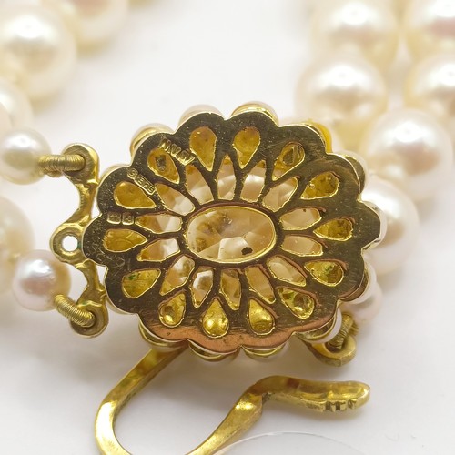 456 - A cultured pearl double necklace, with a 9ct gold and citrine clasp