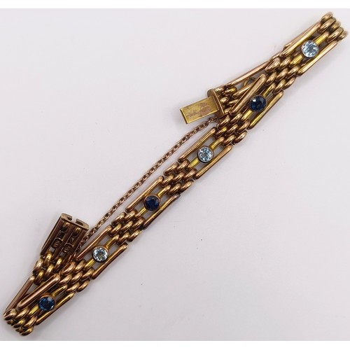 422 - A 9ct gold, aquamarine and sapphire bracelet, 17 g