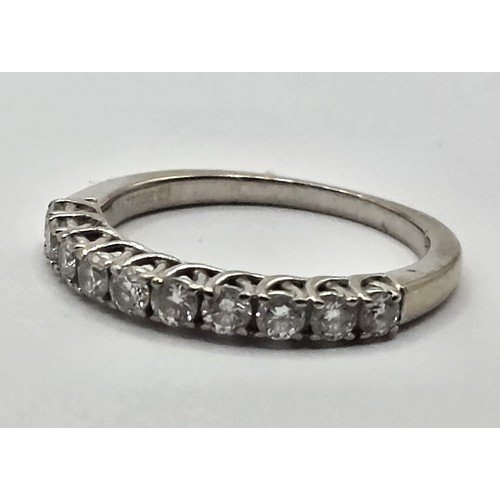 431 - An 18ct white gold and diamond half eternity ring, ring size K