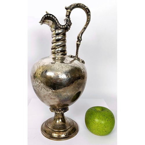 315 - A Victorian silver ewer, with engraved decoration and a vacant cartouche, the acanthus leaf handle t...