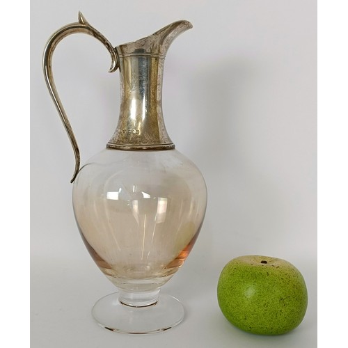 316 - A Dartington glass and silver ewer, with a silver mount, Garrard & Co, London 1996, 27 cm high...