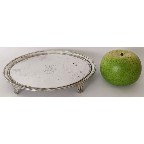 350 - A late 18th century oval silver teapot stand, crested, on four pad feet, London 1777, 8.5 ozt, 20 cm...