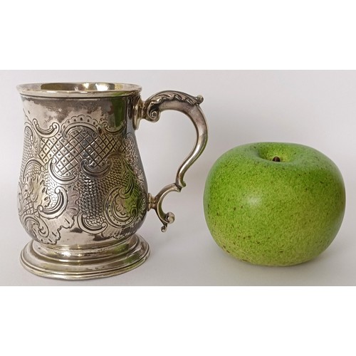 363 - A George III silver mug, initialled, with engraved decoration, 7.7 ozt, 9.5 cm high...
