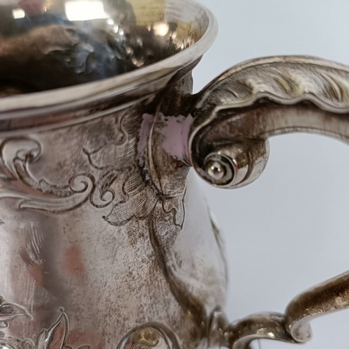 364 - A Victorian silver baluster mug, with embossed decoration, London 1863, 8.6 ozt, 13 cm high...