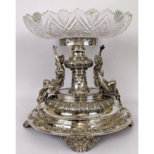 321 - An impressive Edwardian silver and cut glass table centrepiece, of oval form, the base with two lady...