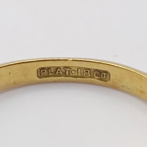 603 - An 18ct gold and platinum ring, lacks stones, 3.1g