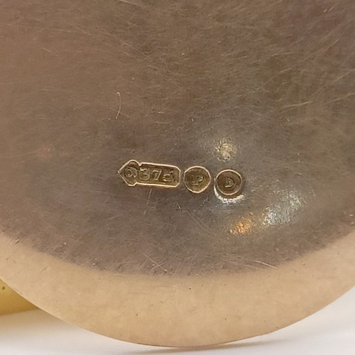 606 - A 9ct gold button, and a 9ct gold tie pin, 5.0 g