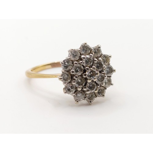 619 - A diamond flowerhead cluster ring, ring size S 1/2