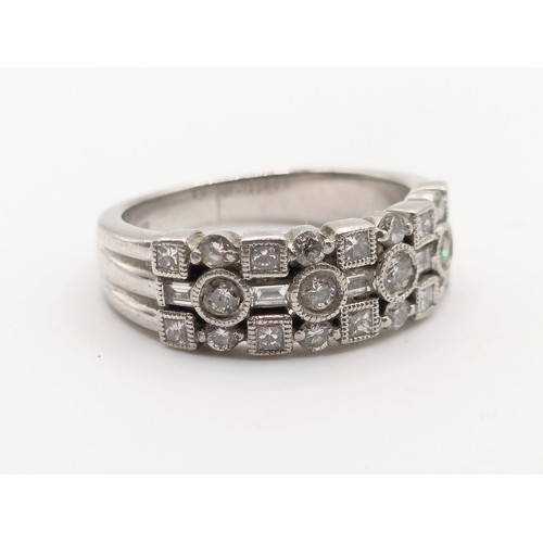 620 - A platinum and diamond ring, ring size N 1/2, 10.0 g