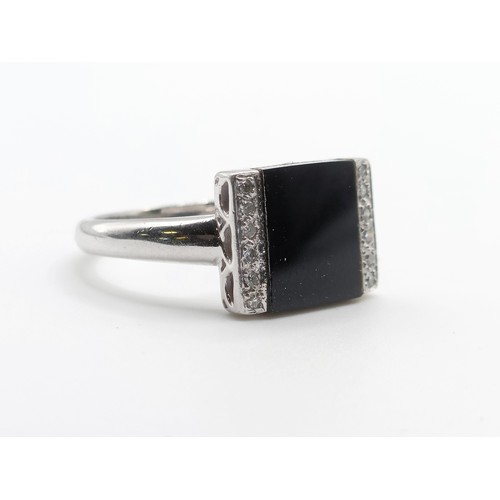 638 - An Art Deco style 9ct gold, diamond and onyx ring, ring size M