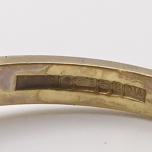 649 - A 9ct gold and solitaire diamond ring, ring size K1/2