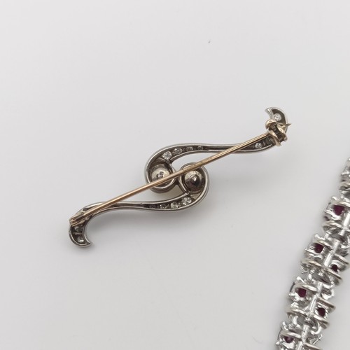 659 - A ruby and diamond bracelet, and a pearl and diamond crossover brooch (2)