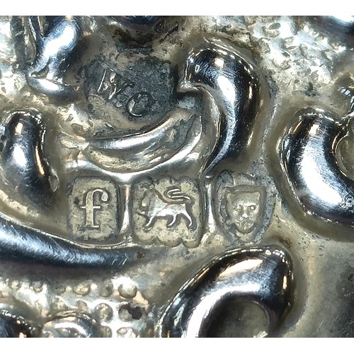 328 - A small embossed silver tray, London 1901, 12 cm wide, and other small items of silver...
