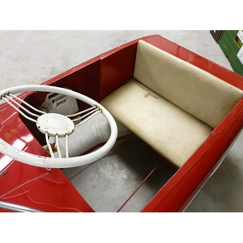 12 - A Ford Zephyr pedal car, painted red over white, possibly Triang