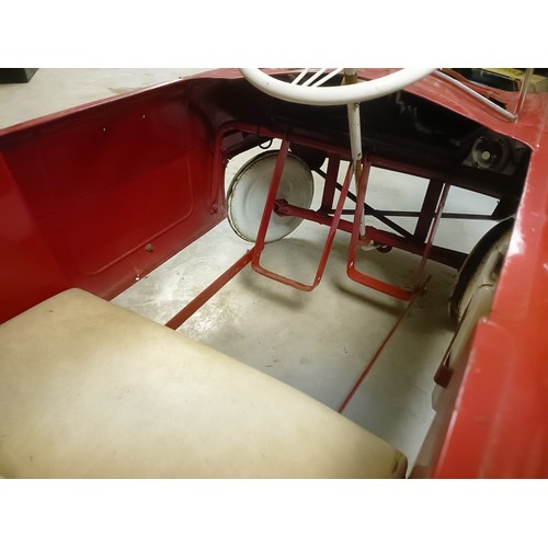12 - A Ford Zephyr pedal car, painted red over white, possibly Triang