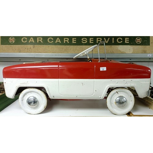12 - A Ford Zephyr pedal car, painted red over white, possibly Triang