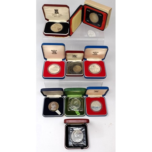 241 - A group of silver proof and other commemorative coins...