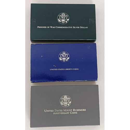 244 - Two United States Liberty coins, 1886-1986, two United States Mount Rushmore Anniversary Coins 1991,...