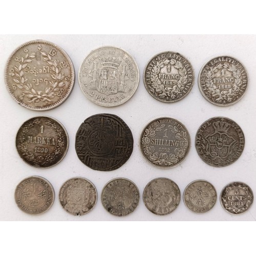 258 - A group of assorted silver world coins, 1874 - 1900, including Hong Kong and Burma...