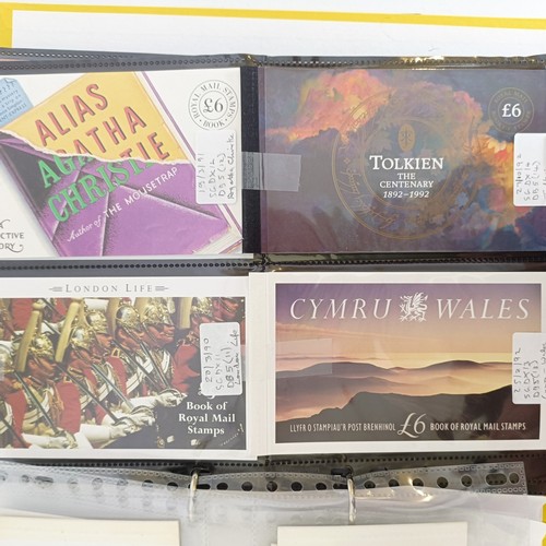 226 - A collection of Royal Mail Prestige booklets, 1980-2004, in an album...