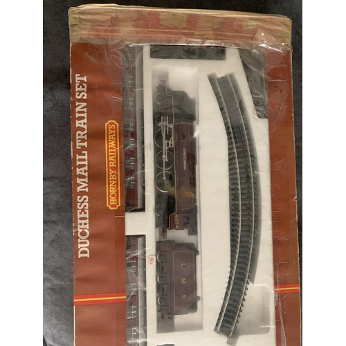 554 - Hornby Railways Duchess Mail Train setHornby Railways Duchess Mail Train set (R542) box is worn as s... 