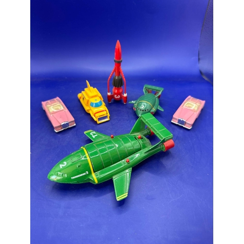 126 - Six loose Thunderbirds vehicles, including Matchbox Thunderbirds two diecast