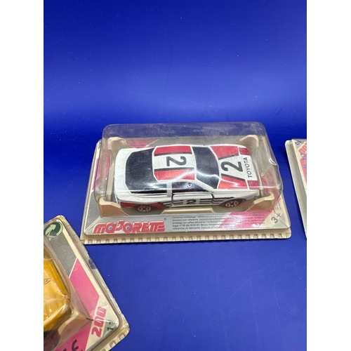 132 - 4 x majorette diecast vehicles on bubble card. This includes a 235 golf GTi Lamborghini 214 Nissan 3... 