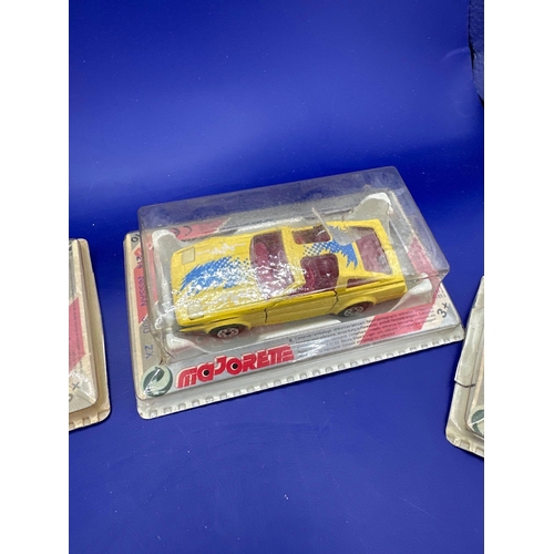 132 - 4 x majorette diecast vehicles on bubble card. This includes a 235 golf GTi Lamborghini 214 Nissan 3... 