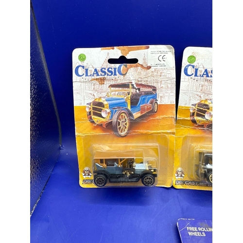 133 - 4 x diecasts on card, one street scenes, black cab and three classics. Item number 30106