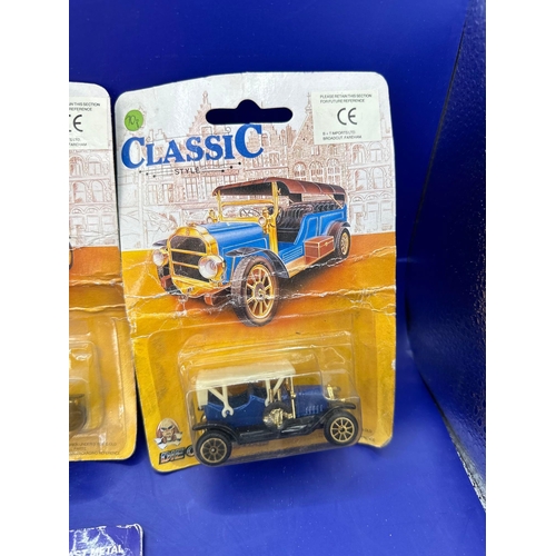 133 - 4 x diecasts on card, one street scenes, black cab and three classics. Item number 30106