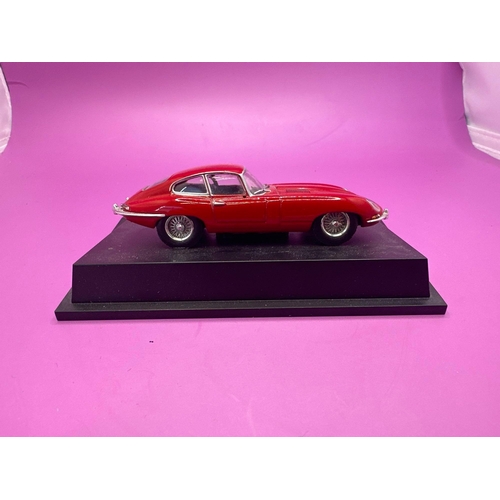 233 - Unboxed Jaguar E-Type on stand as pictured