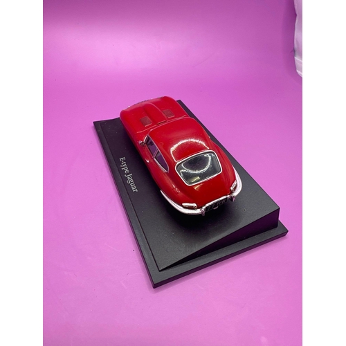 233 - Unboxed Jaguar E-Type on stand as pictured