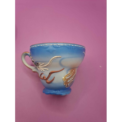 519 - Bruges tea cup and saucer with a dragon theme