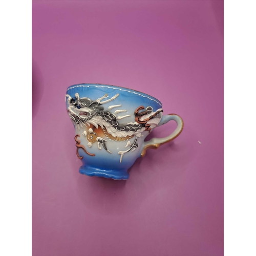 519 - Bruges tea cup and saucer with a dragon theme