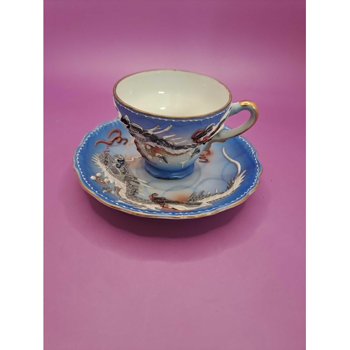 519 - Bruges tea cup and saucer with a dragon theme