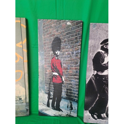 549 - 3x Banksy art canvas prints 26cm by 61cm