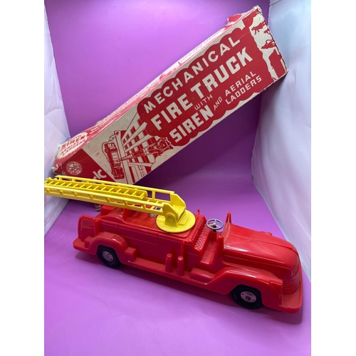 117 - Marx toys plastic fire truck, mechanical fire truck with box but damaged as pictured.