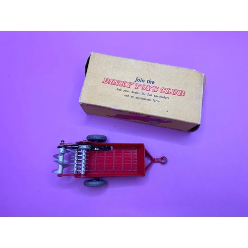 183 - Dinky Toys 321 Massy-Harris Manure Spreader in red with yellow wheel hubs. (Box damaged)