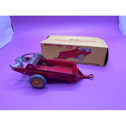 183 - Dinky Toys 321 Massy-Harris Manure Spreader in red with yellow wheel hubs. (Box damaged)