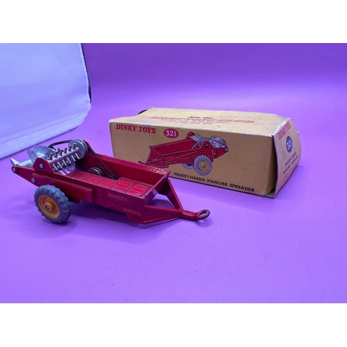 183 - Dinky Toys 321 Massy-Harris Manure Spreader in red with yellow wheel hubs. (Box damaged)