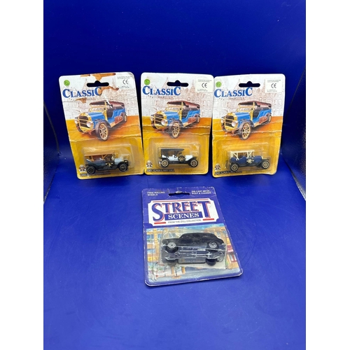 296 - 4 x diecasts on card, one street scenes, black cab and three classics. Item number 30106