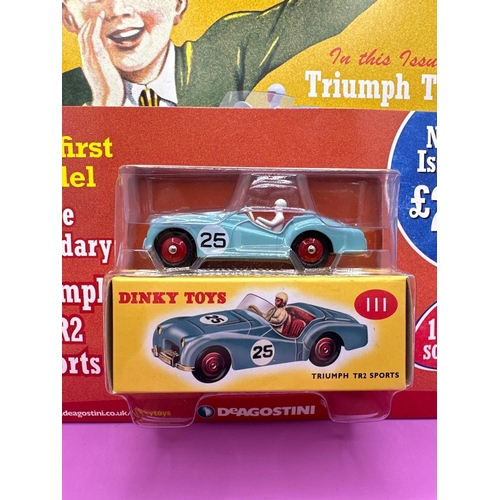 125 - Dinky Toys Comic and Vehicle manufactured by Norev. Comes with Triumph TR2 sports car with number 25... 