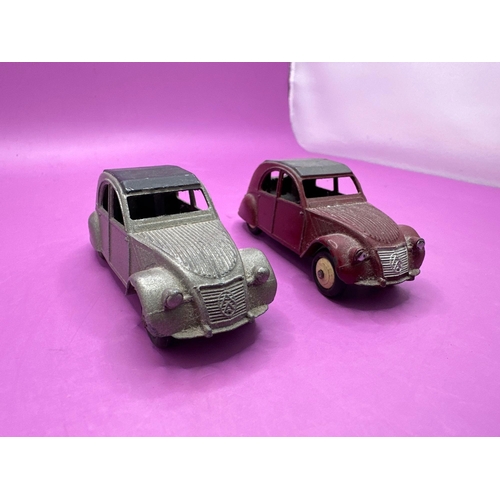 135 - 2x dinky toys, unbox models, Citroen, 2CV, one in grey one in burgundy.